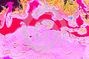 Abstract red-pink marble background. The lines and waves of acrylic paint create an interesting structure.