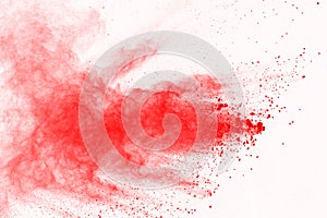 Abstract of red powder explosion on white background. Red powder splatted isolate. Colored cloud. Colored dust explode. Paint Holi