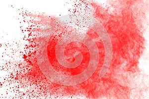Abstract of red powder explosion on white background. Red powder splatted isolate. Colored cloud. Colored dust explode. Paint Holi
