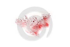 Abstract red powder splatted on white background.