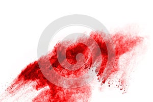 Abstract red powder splatted on white background.