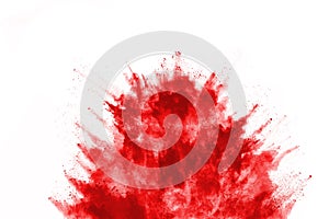 Abstract red powder splatted on white background.