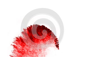 Abstract red powder splatted on white background.