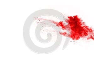 Abstract red powder splatted on white background.