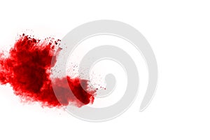 Abstract red powder splatted on white background.