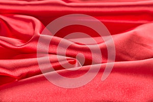 Abstract red satin fabric background