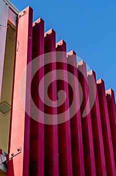 Abstract Red slat texture pattern with blue background