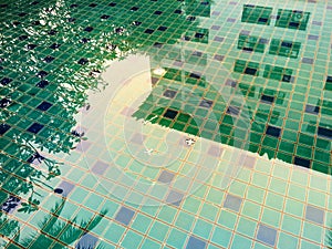 Abstract reflection building in the water in colorful swimming pool