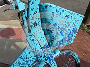 Abstract Rental Bicycle Parked on the Sidewalk