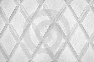 Abstract rhombus shape white and black color background close up, gray concrete wall with diamond texture pattern, copy space