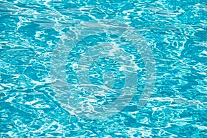Abstract ripple wave and clear turquoise water surface in swimming pool, blue water wave for background and abstract