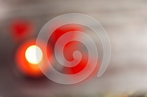 Abstract romanticbokeh of candle light and red blured hearts