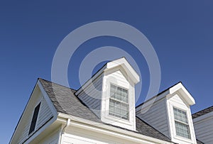 Abstract Roof of House and Windows Against Deep Blue Sky