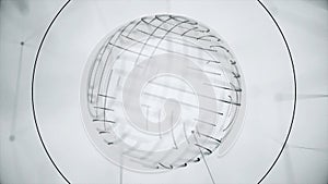 Abstract rotating circles of dotted lines on white background. Plexuses of point lines in rotating sphere with circles