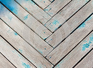 Abstract rough wooden background, old wall of wooden planks folded herringbone