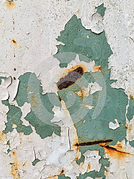 Abstract rusted grunge metal surface with white green paint and scratches