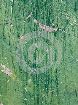 Abstract rusted grunge metal surface with white green paint and scratches