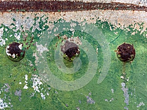 Abstract rusted grunge metal surface with white green paint and scratches