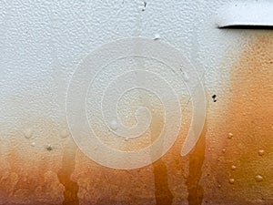 Abstract rusted grunge metal surface with white yellow paint