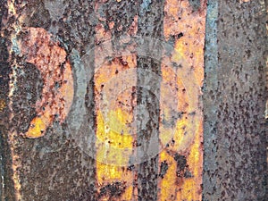 Abstract rusted grunge metal surface with white yellow paint