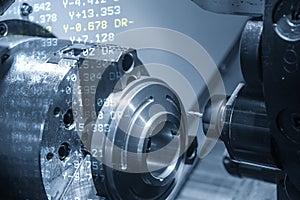 The abstract scene of CNC lathe machine and G-code data.