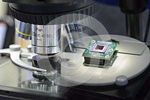 Abstract scene of microscope and the microchip.