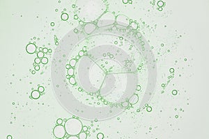 abstract science background, backlit green liquid biology or chemistry themed macro photograph