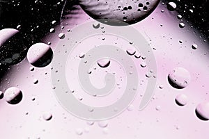 Abstract science concept background with oil drop in water. Monochromatic effects with blurred and sharpen circles together.