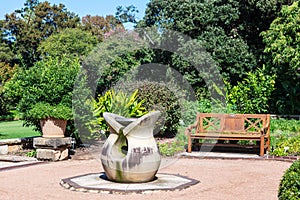 Abstract sculpture housing large bird bath in Sydney Botanic Gardens.