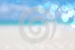 Abstract sea background. Abstract sandy summer beach background with bokeh lights on light blue sky. Beautiful texture. Space