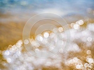 Abstract sea background. Abstract sandy summer beach background with bokeh lights on light blue sky. Beautiful texture. Space