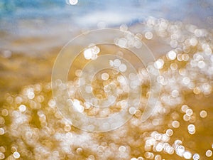 Abstract sea background. Abstract sandy summer beach background with bokeh lights on light blue sky. Beautiful texture. Space