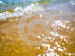 Abstract sea background. Abstract sandy summer beach background with bokeh lights on light blue sky. Beautiful texture. Space