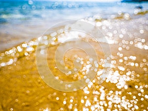 Abstract sea background. Abstract sandy summer beach background with bokeh lights on light blue sky. Beautiful texture. Space