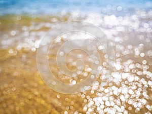 Abstract sea background. Abstract sandy summer beach background with bokeh lights on light blue sky. Beautiful texture. Space