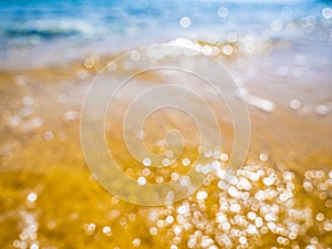 Abstract sea background. Abstract sandy summer beach background with bokeh lights on light blue sky. Beautiful texture. Space