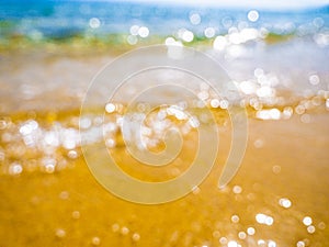 Abstract sea background. Abstract sandy summer beach background with bokeh lights on light blue sky. Beautiful texture. Space