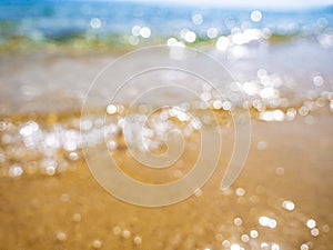 Abstract sea background. Abstract sandy summer beach background with bokeh lights on light blue sky. Beautiful texture. Space