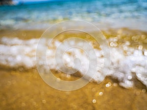 Abstract sea background. Abstract sandy summer beach background with bokeh lights on light blue sky. Beautiful texture. Space