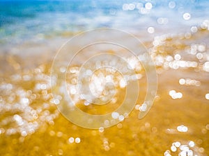 Abstract sea background. Abstract sandy summer beach background with bokeh lights on light blue sky. Beautiful texture. Space