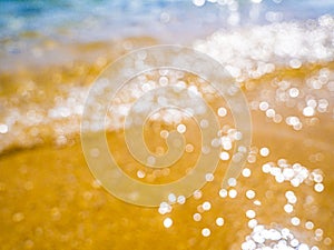 Abstract sea background. Abstract sandy summer beach background with bokeh lights on light blue sky. Beautiful texture. Space