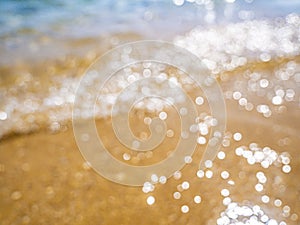 Abstract sea background. Abstract sandy summer beach background with bokeh lights on light blue sky. Beautiful texture. Space