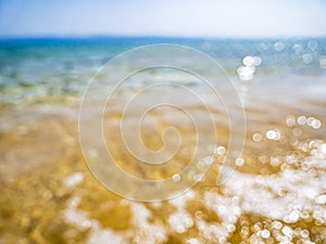 Abstract sea background. Abstract sandy summer beach background with bokeh lights on light blue sky. Beautiful texture. Space