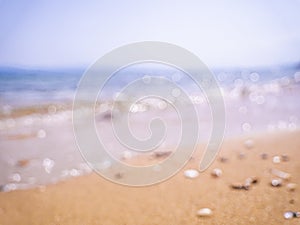 Abstract sea background. Abstract sandy summer beach background with bokeh lights on light blue sky. Beautiful texture. Space