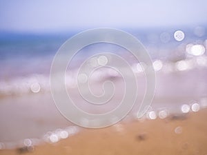 Abstract sea background. Abstract sandy summer beach background with bokeh lights on light blue sky. Beautiful texture. Space