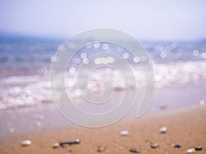 Abstract sea background. Abstract sandy summer beach background with bokeh lights on light blue sky. Beautiful texture. Space