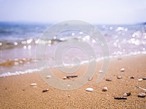 Abstract sea background. Abstract sandy summer beach background with bokeh lights on light blue sky. Beautiful texture. Space