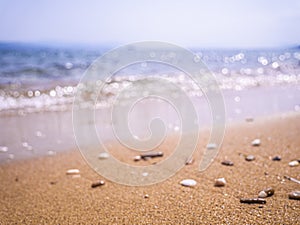 Abstract sea background. Abstract sandy summer beach background with bokeh lights on light blue sky. Beautiful texture. Space