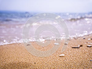 Abstract sea background. Abstract sandy summer beach background with bokeh lights on light blue sky. Beautiful texture. Space