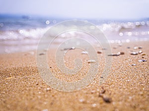 Abstract sea background. Abstract sandy summer beach background with bokeh lights on light blue sky. Beautiful texture. Space